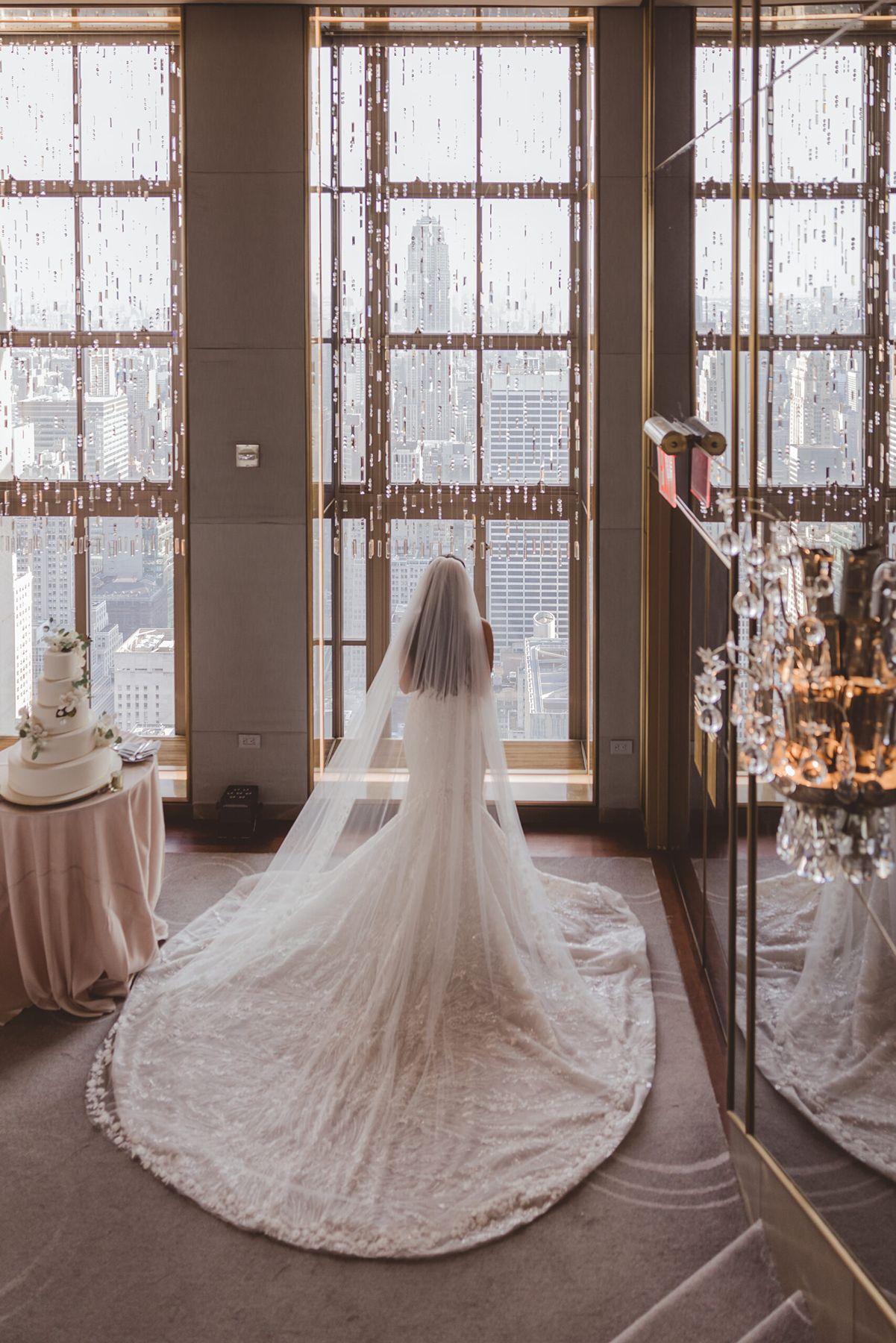 Bride overlooking the NYC skyline from the Rainbow Room at Rockefeller Center