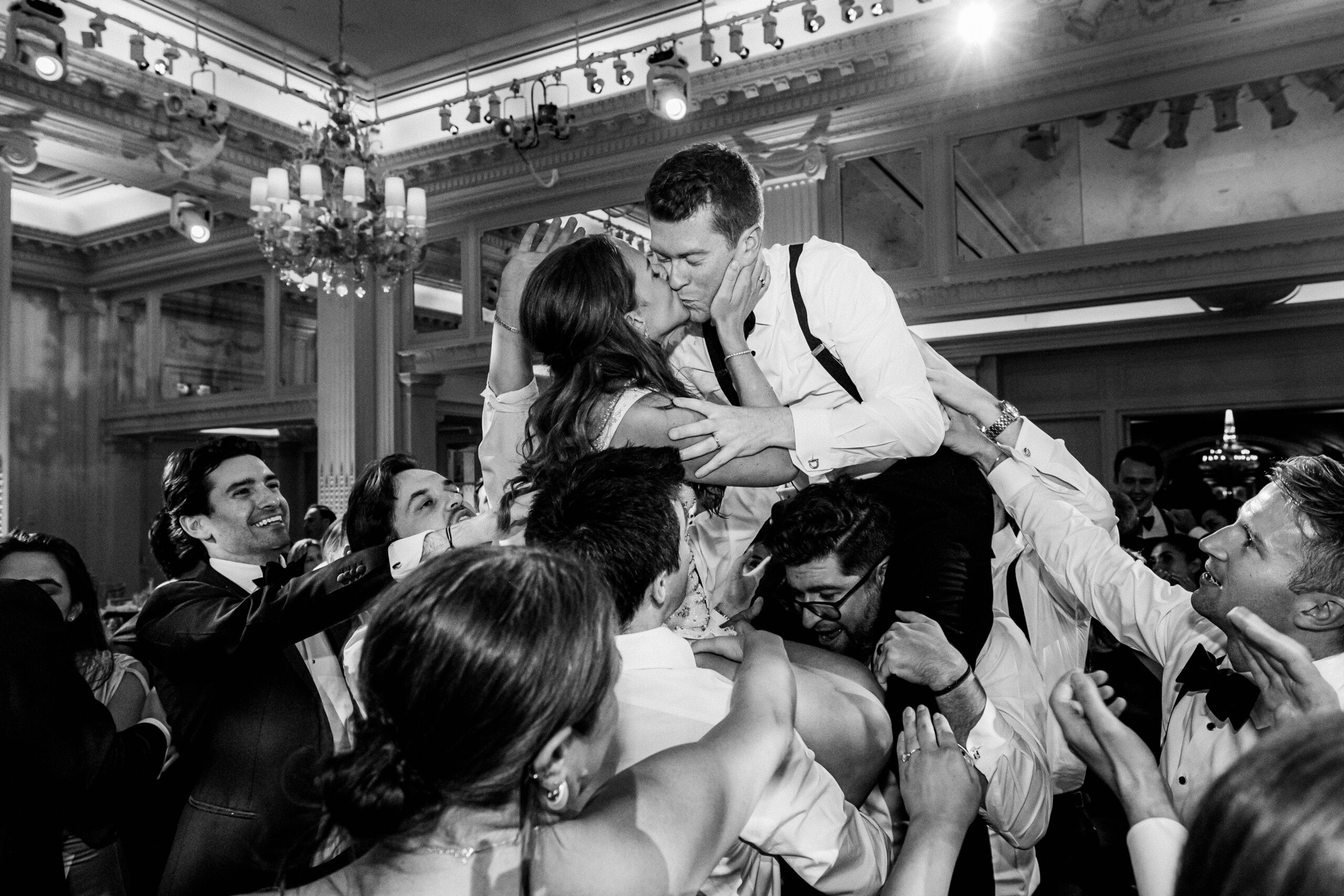 A bride and groom share a kiss as they are lifted above partygoers in an elegant reception hall. best wedding photographers in Connecticut
best wedding photographers in New York city
best wedding photographers in tri-state area
Connecticut wedding photographer
Connecticut wedding planning
getaway wedding photographer
Litchfield county wedding photographer
Manhattan wedding planning
New York wedding photographer
travel wedding photographer
wedding day schedule
wedding day schedule template
wedding day timeline
wedding planning tips
wedding schedule template
when to start getting ready on my wedding day