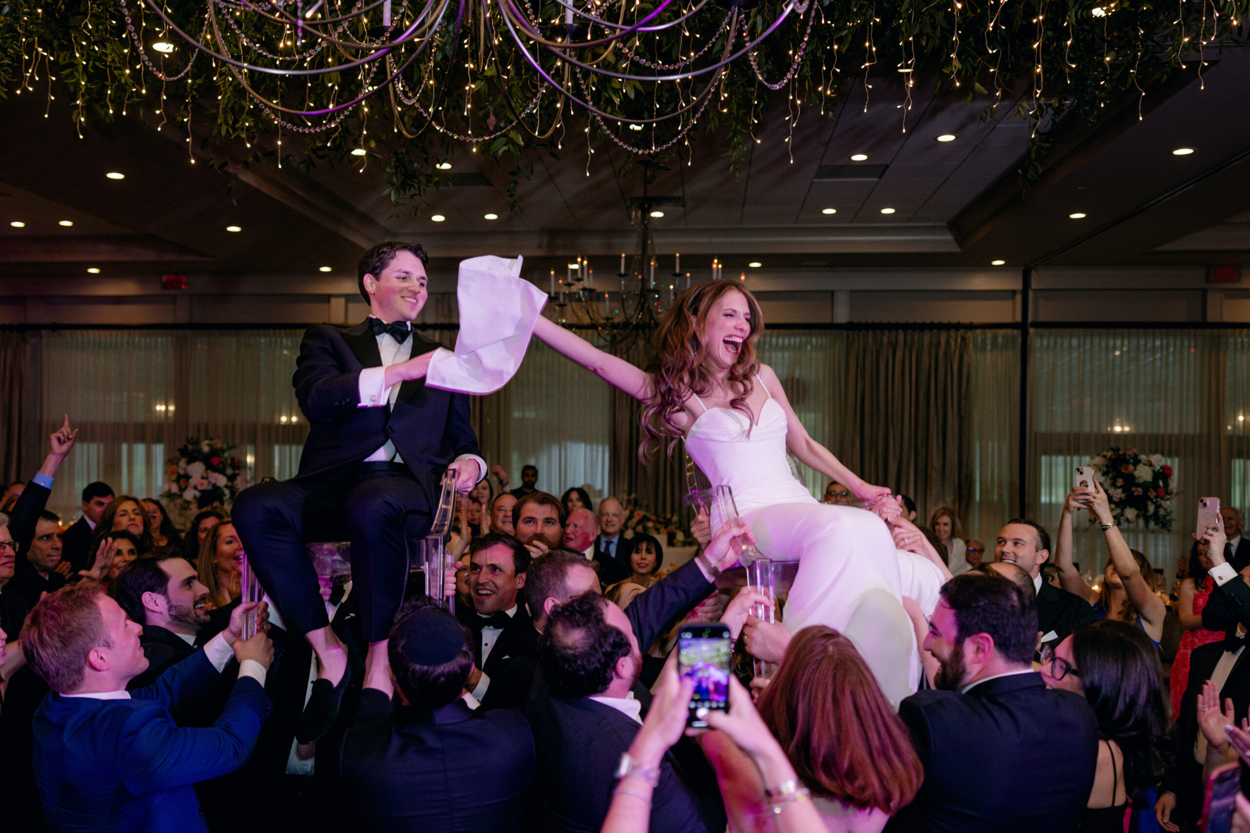 A bride and groom are lifted above the crowd in a Hora dance. best wedding photographers in Connecticut
best wedding photographers in New York city
best wedding photographers in tri-state area
Connecticut wedding photographer
Connecticut wedding planning
getaway wedding photographer
Litchfield county wedding photographer
Manhattan wedding planning
New York wedding photographer
travel wedding photographer
wedding day schedule
wedding day schedule template
wedding day timeline
wedding planning tips
wedding schedule template
when to start getting ready on my wedding day