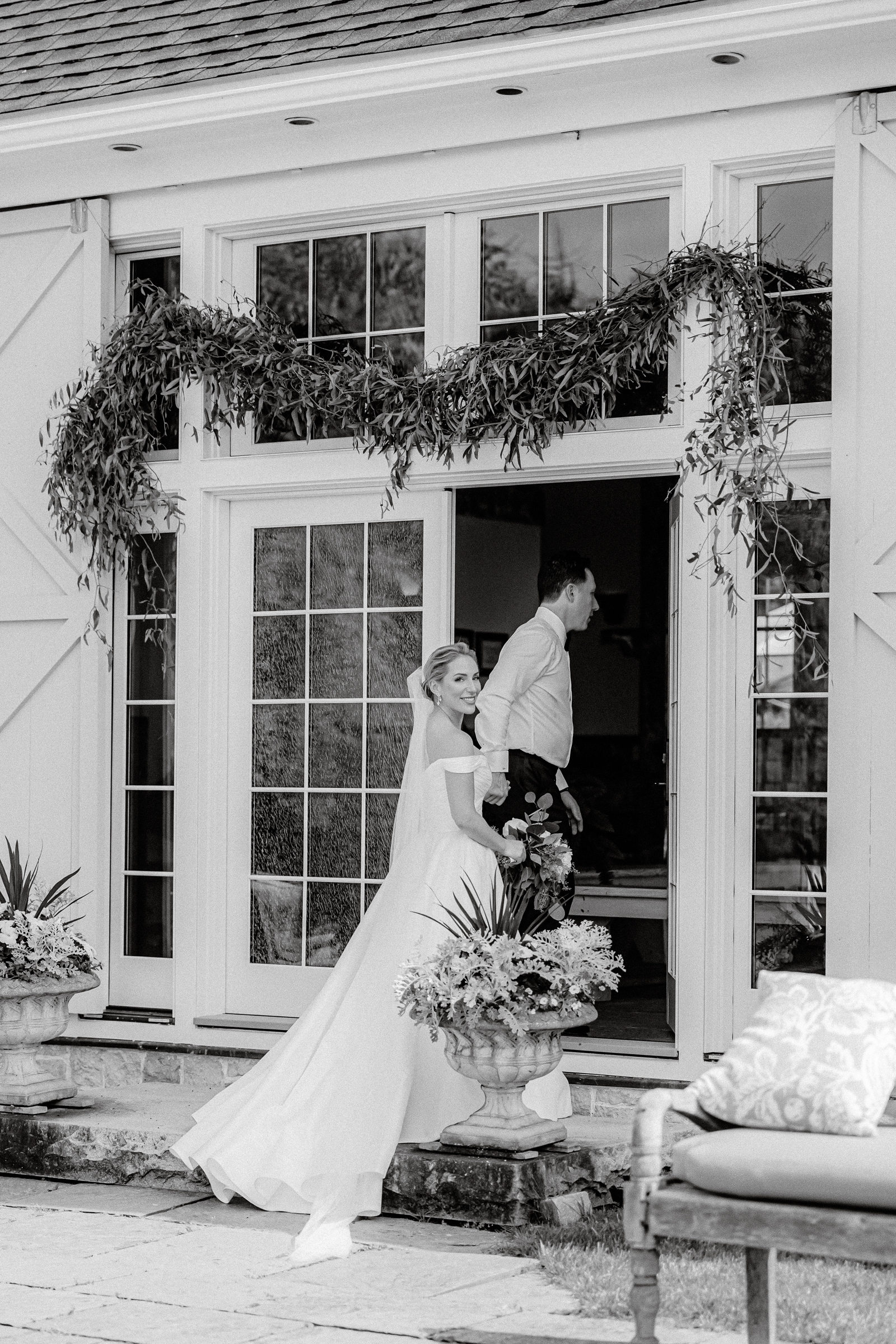 Newlywed Couple Holding Hands While Taking Photos at LionRock Farm Wedding