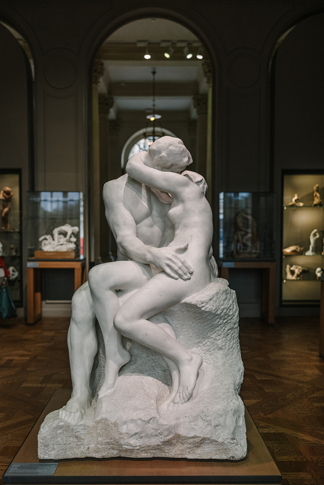 rodin sculpture of man and woman kissing in the musee rodin paris