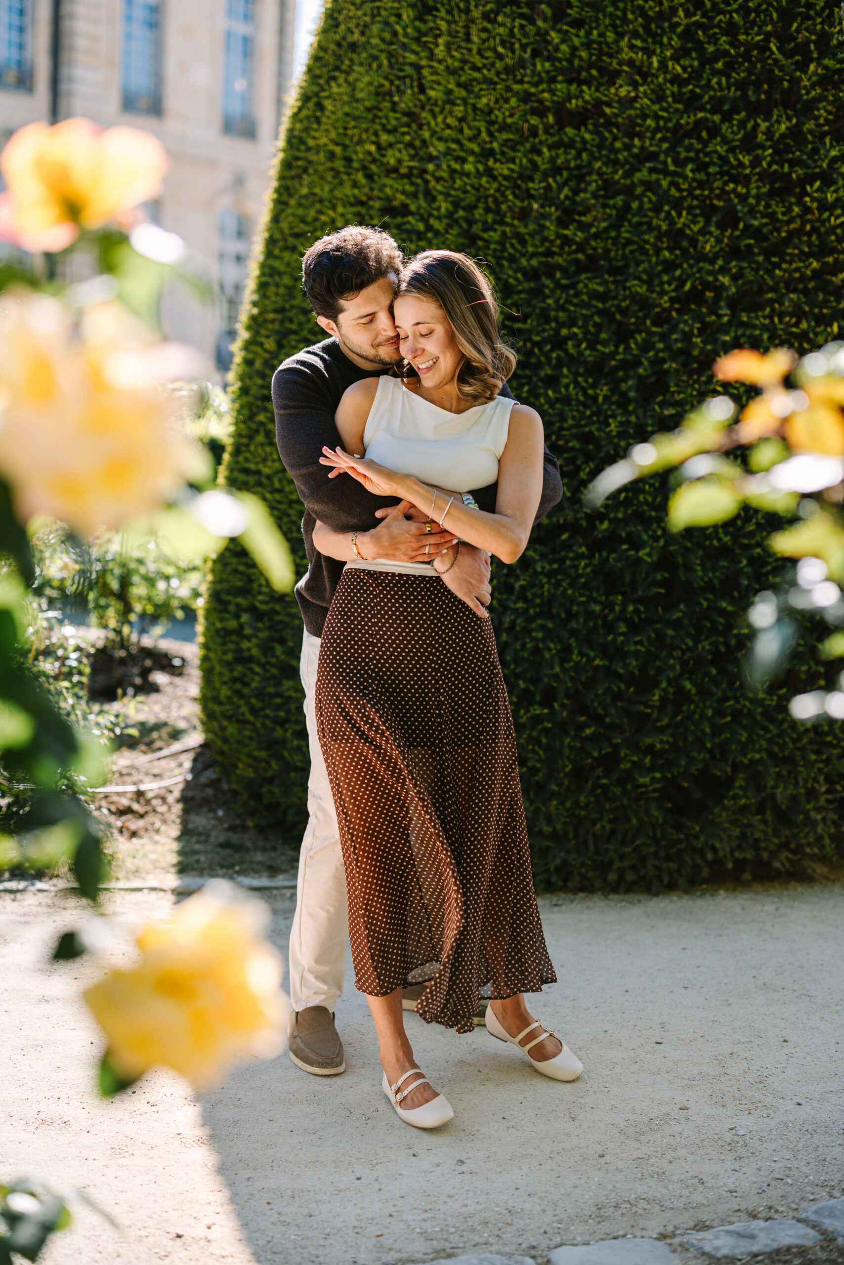 Couple Embracing After Proposal at Musée Rodin in Paris France