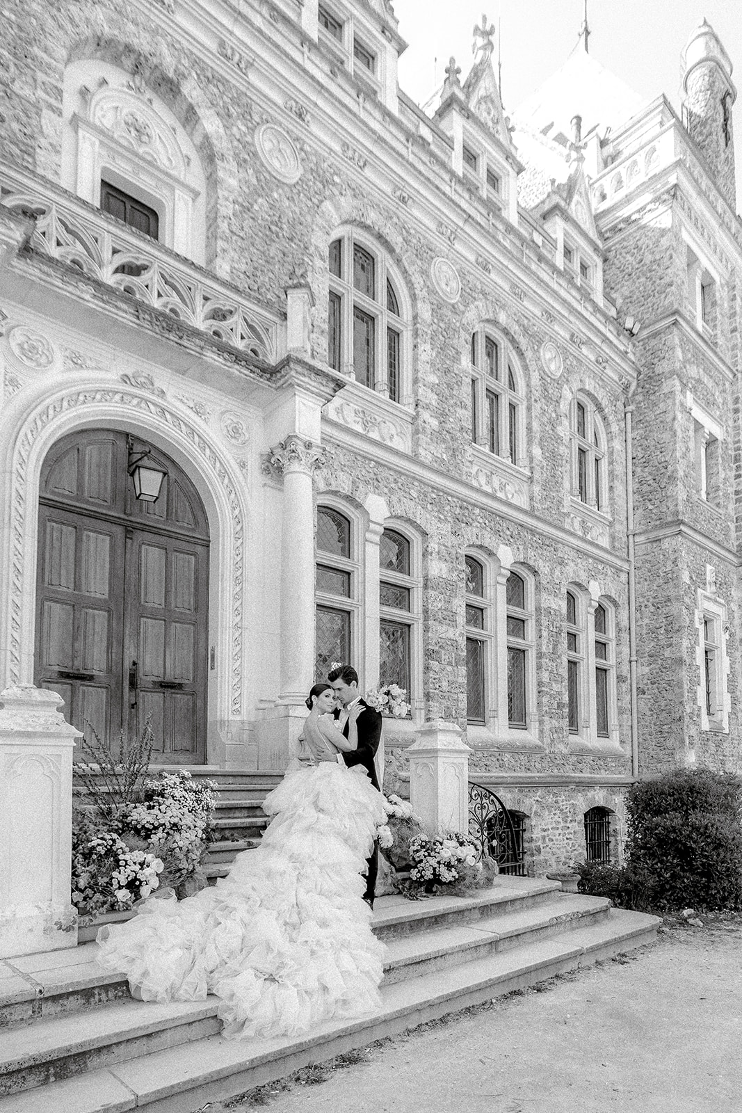 bride and groom embrace during French countryside chateau wedding