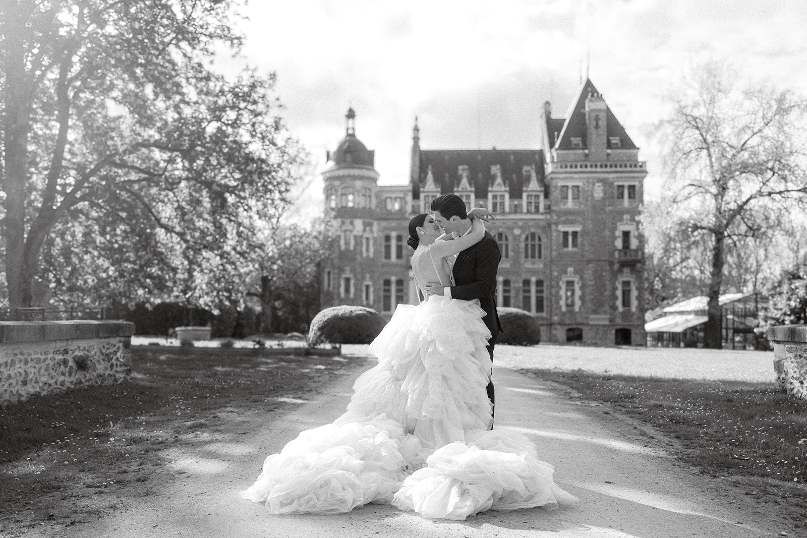 bride and groom just married in front of a chateau near paris, france