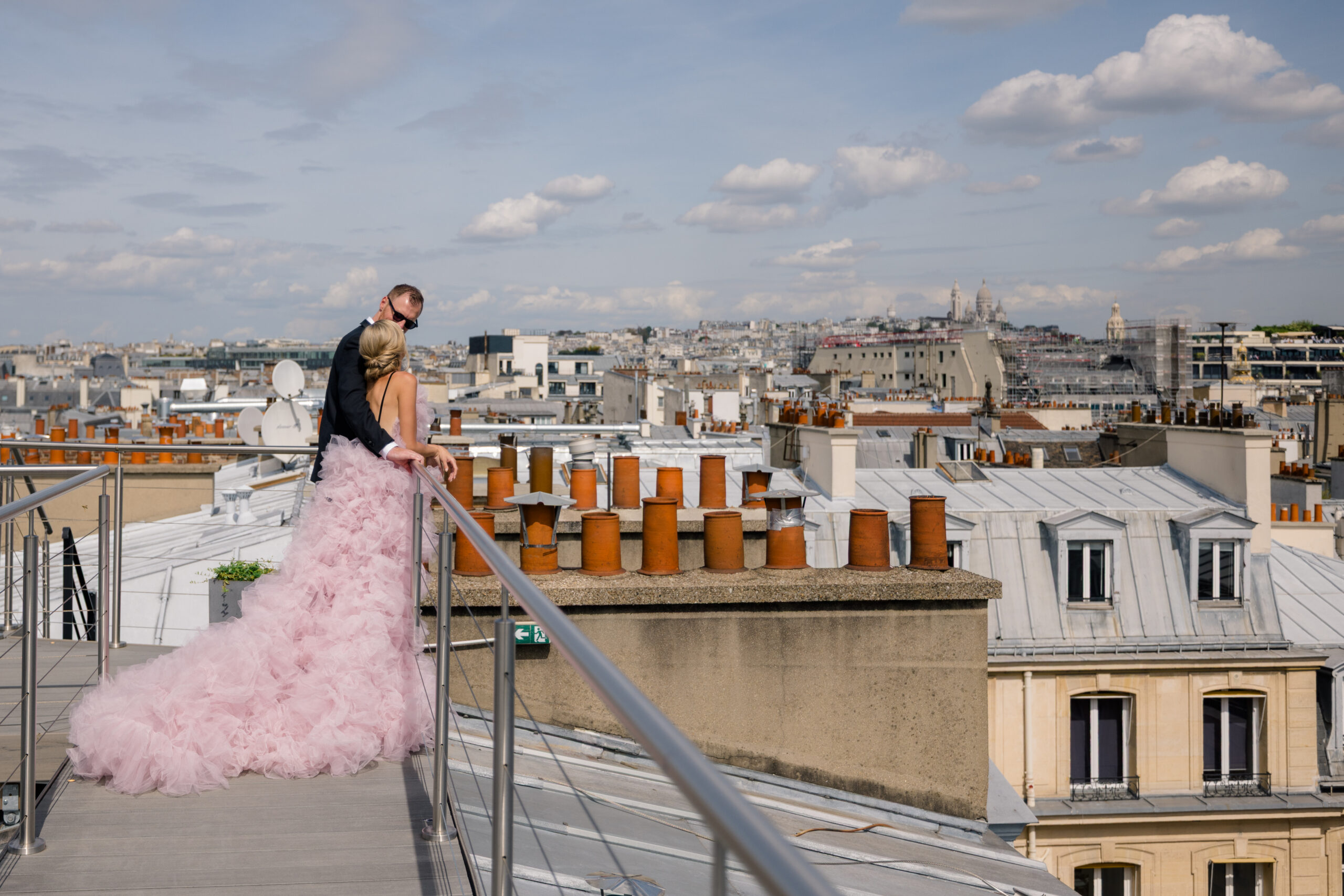 Fashion Forward Engaged Couple Standing on Rooftop of Hôtel Alfred Sommier, Paris, view sacre coeur in montmartre
