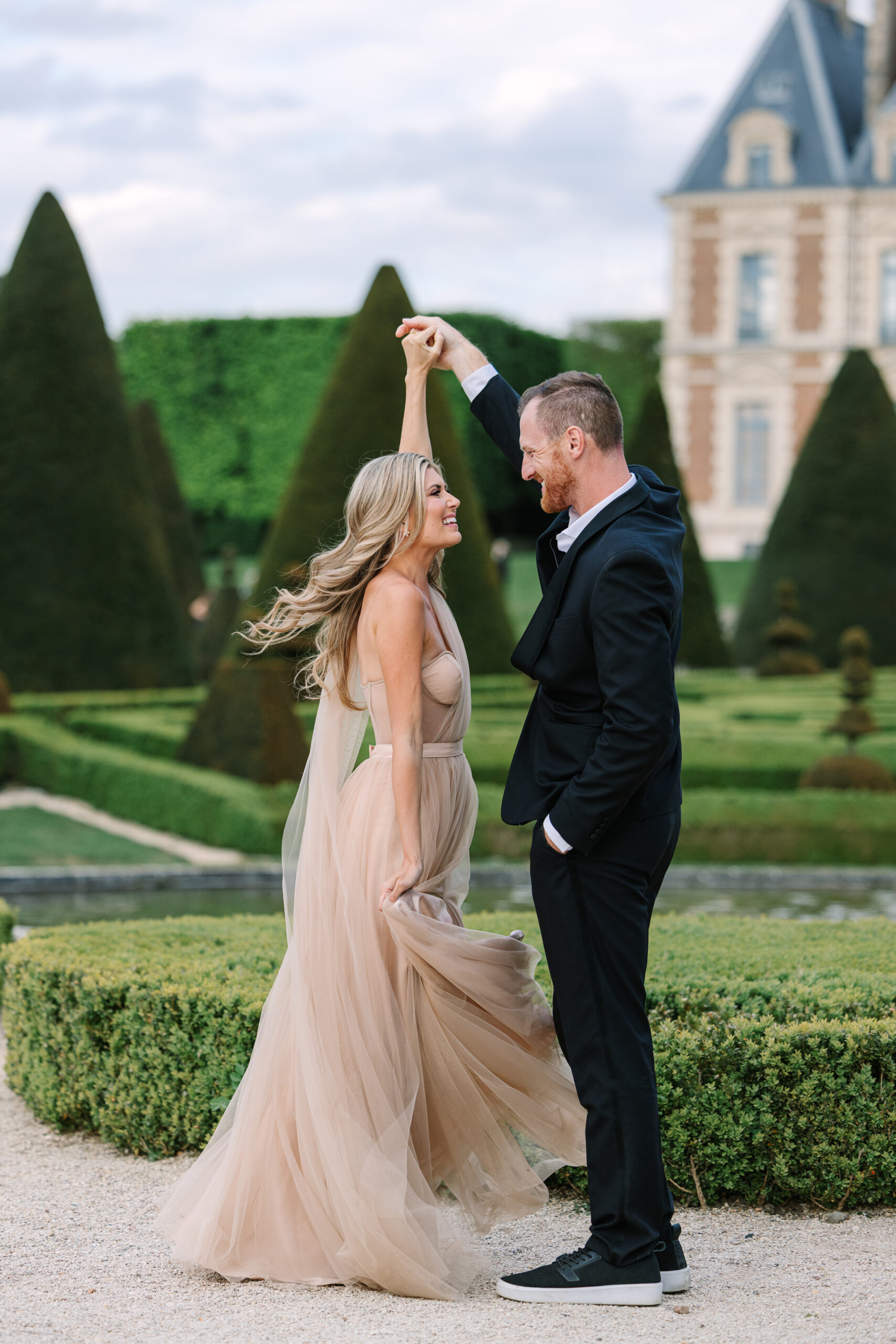 Couple Dance in Gardens at Château de Sceaux in Paris During Engagement Photography