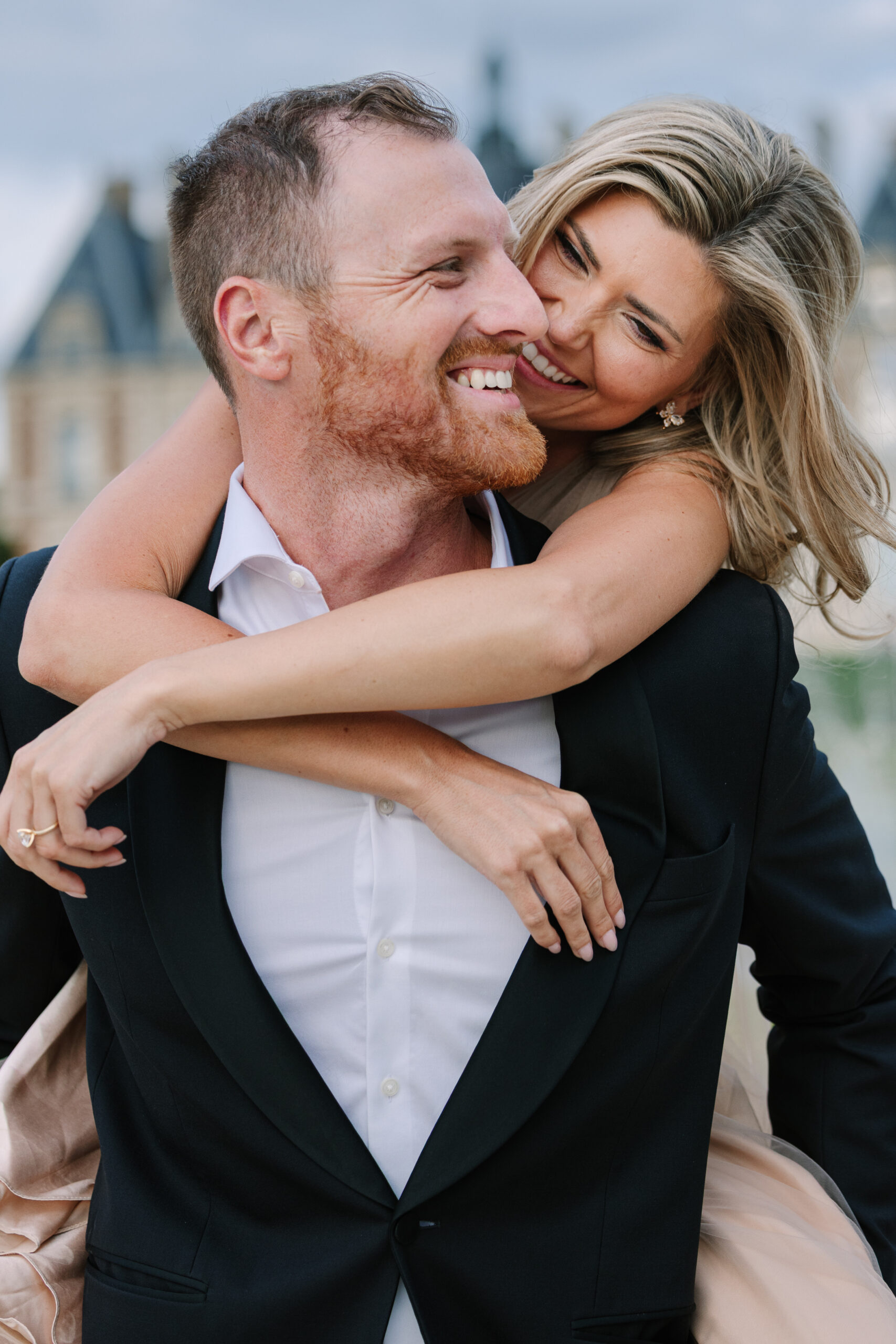 Groom to be Carries Fiance on Back During Engagement Photos in Paris