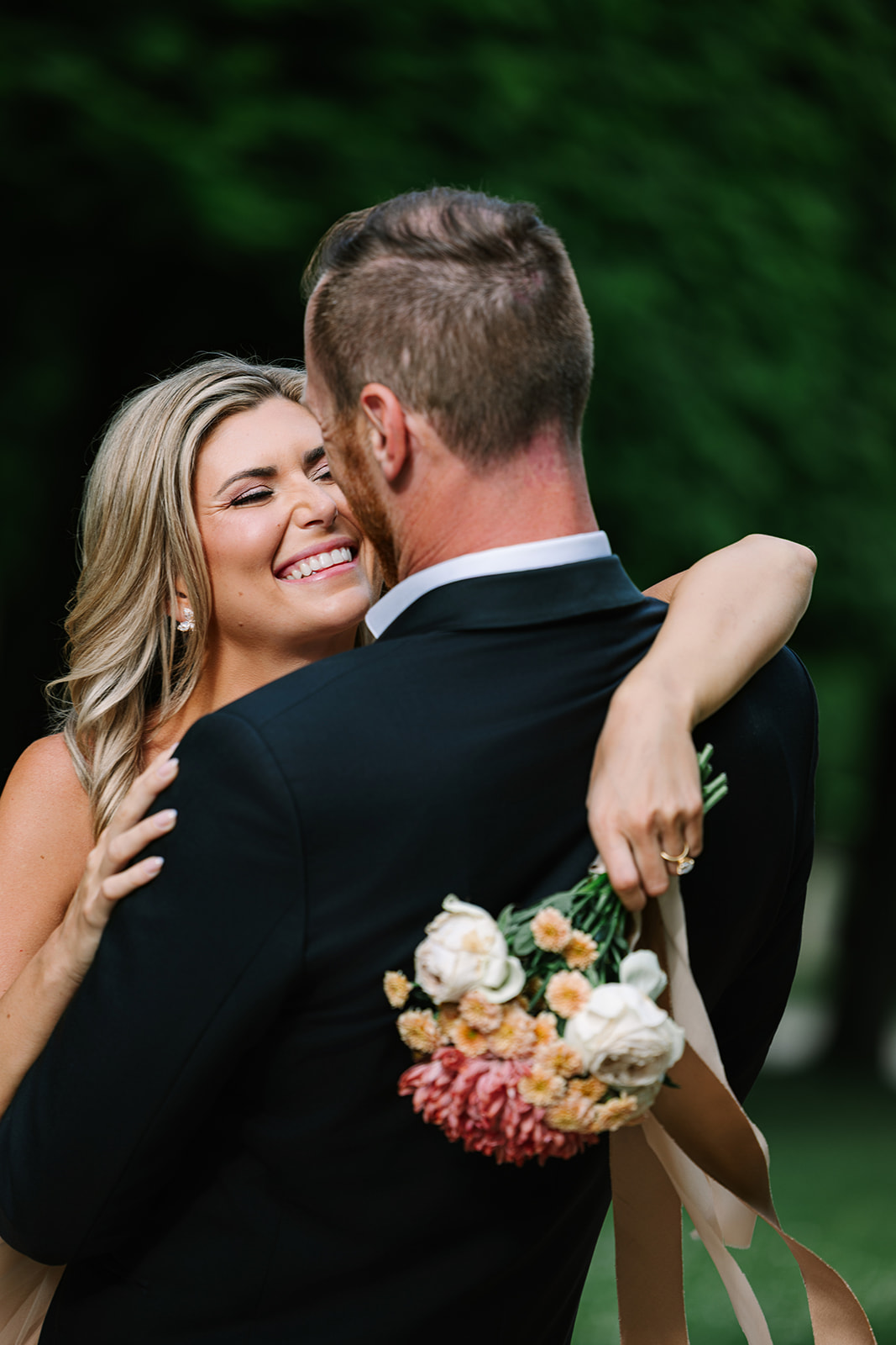 Candid Moment of Woman Sharing Laugh with Fiance During Paris Engagement Photos