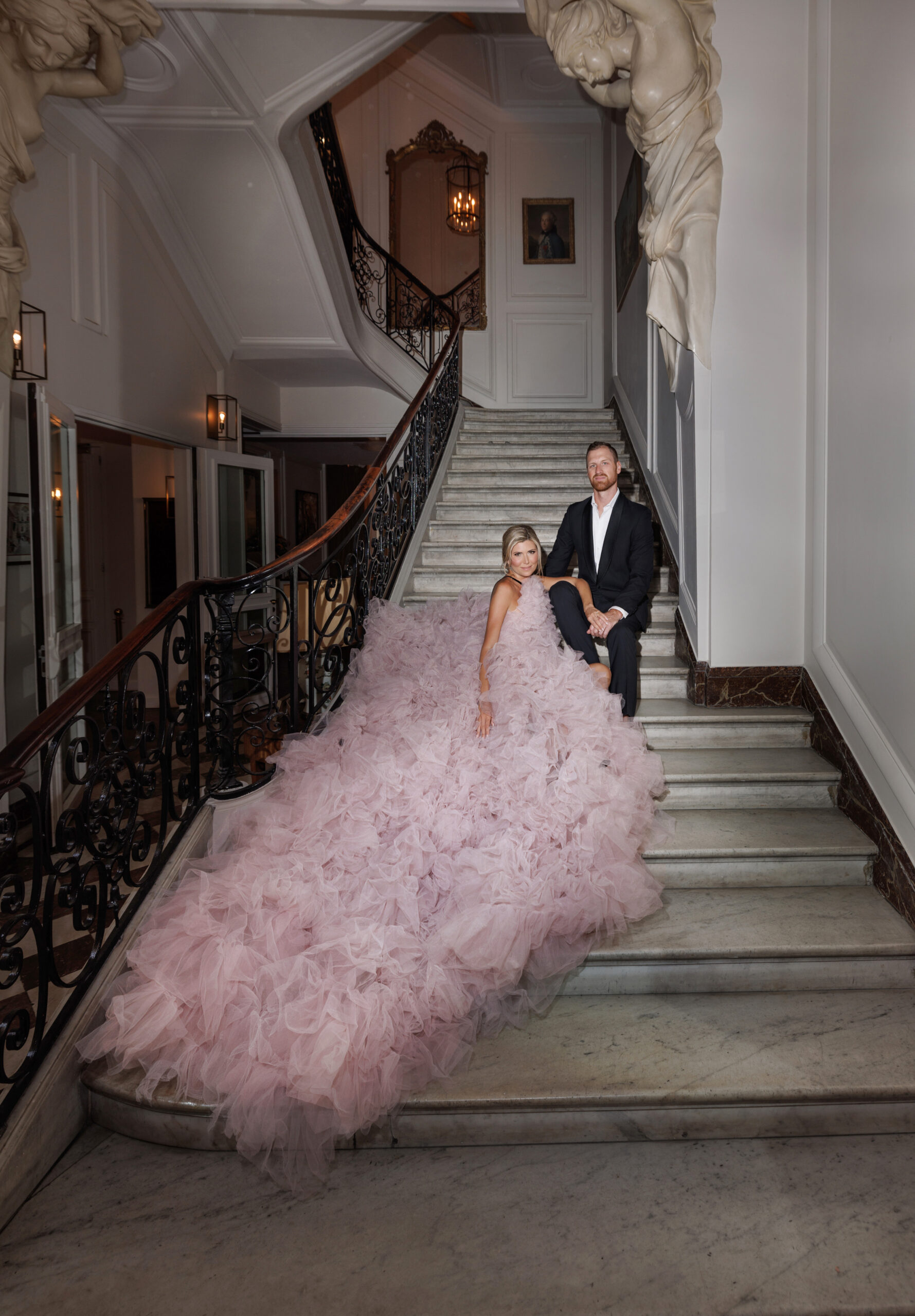 Engaged Couple sit on Marble Stairs of Hôtel Alfred Sommier, Paris, staircase in paris